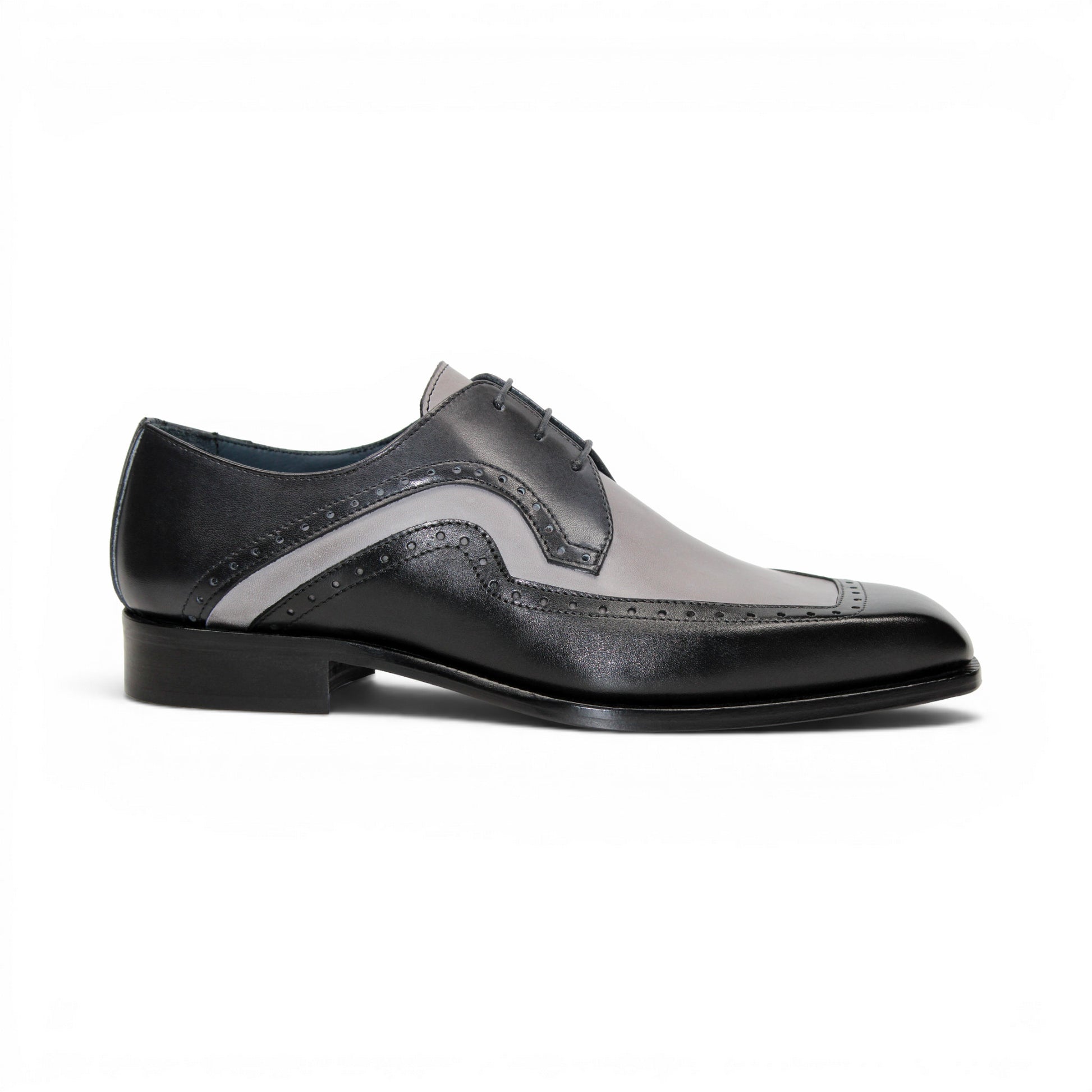 The Duca Di Matiste Duca Velletri Black Combo is a black and gray calf leather dress shoe with brogue detailing, lace-up closure, and low heel, shown side profile on white for timeless style.