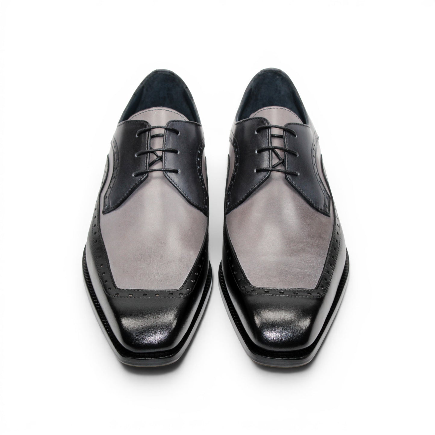 The Duca Di Matiste Duca Velletri Black Combo is a black and gray calf leather dress shoe with brogue detailing, lace-up closure, and low heel, shown side profile on white for timeless style.