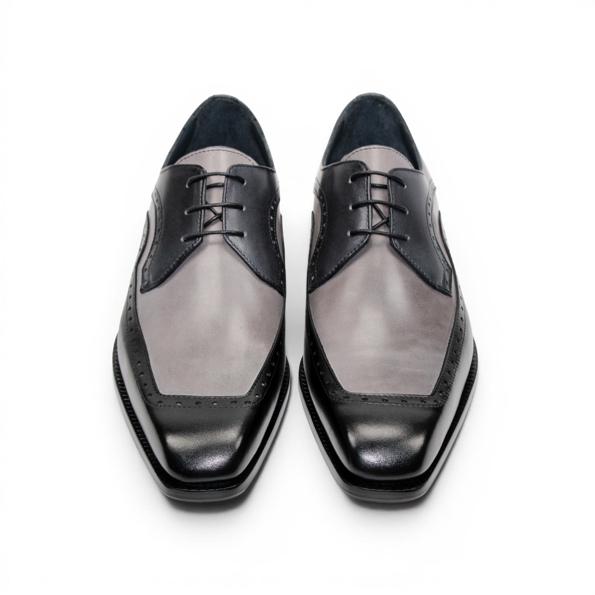 The Duca Di Matiste Duca Velletri Black Combo is a black and gray calf leather dress shoe with brogue detailing, lace-up closure, and low heel, shown side profile on white for timeless style.