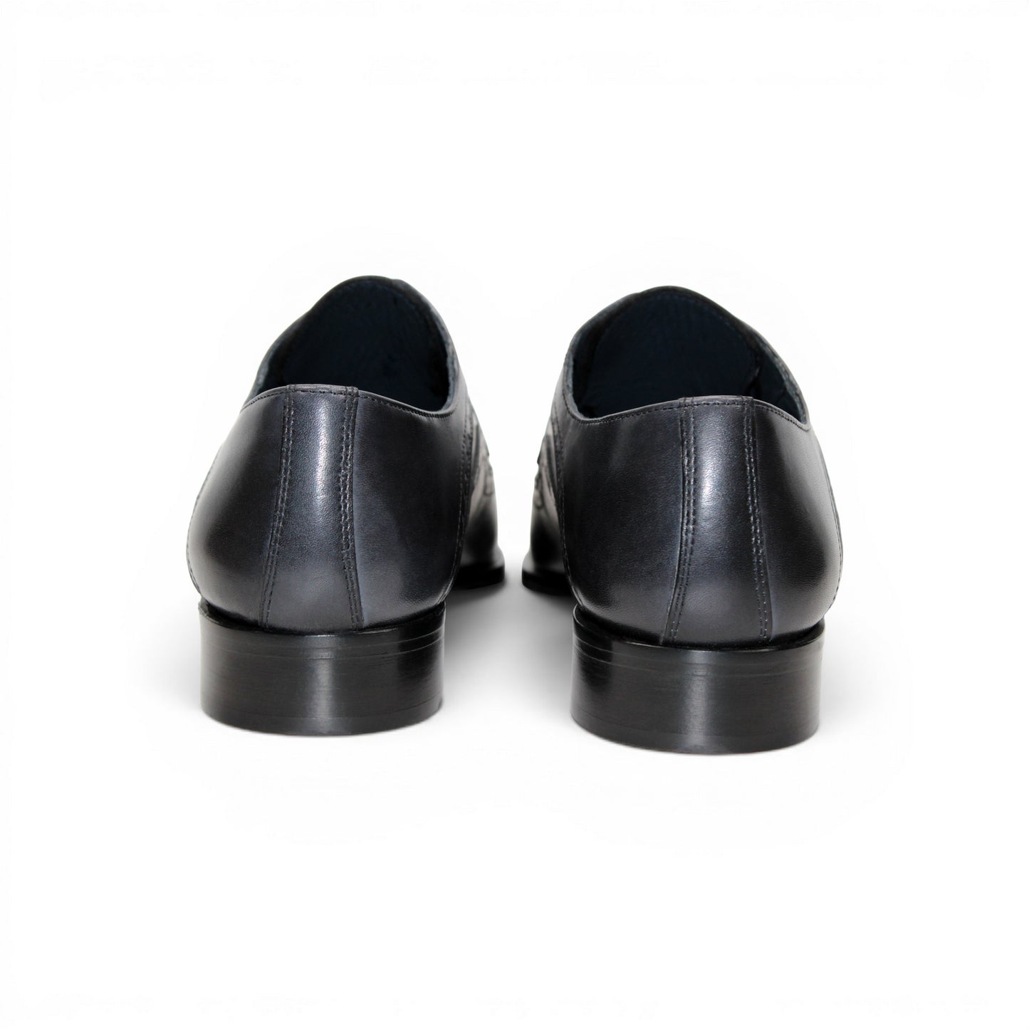 The Duca Di Matiste Duca Velletri Black Combo is a black and gray calf leather dress shoe with brogue detailing, lace-up closure, and low heel, shown side profile on white for timeless style.