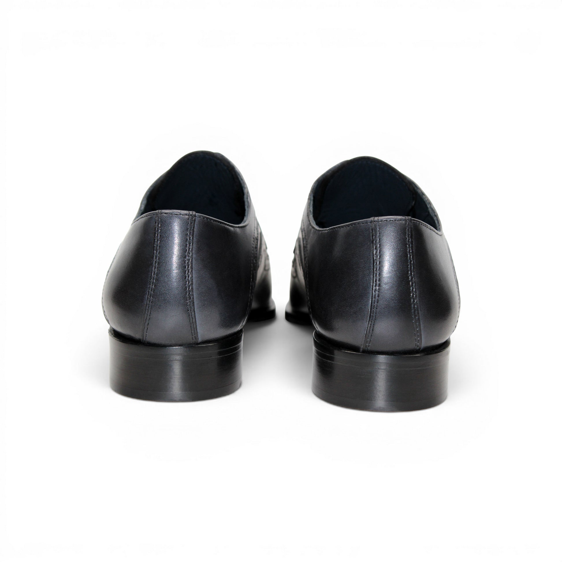 The Duca Di Matiste Duca Velletri Black Combo is a black and gray calf leather dress shoe with brogue detailing, lace-up closure, and low heel, shown side profile on white for timeless style.