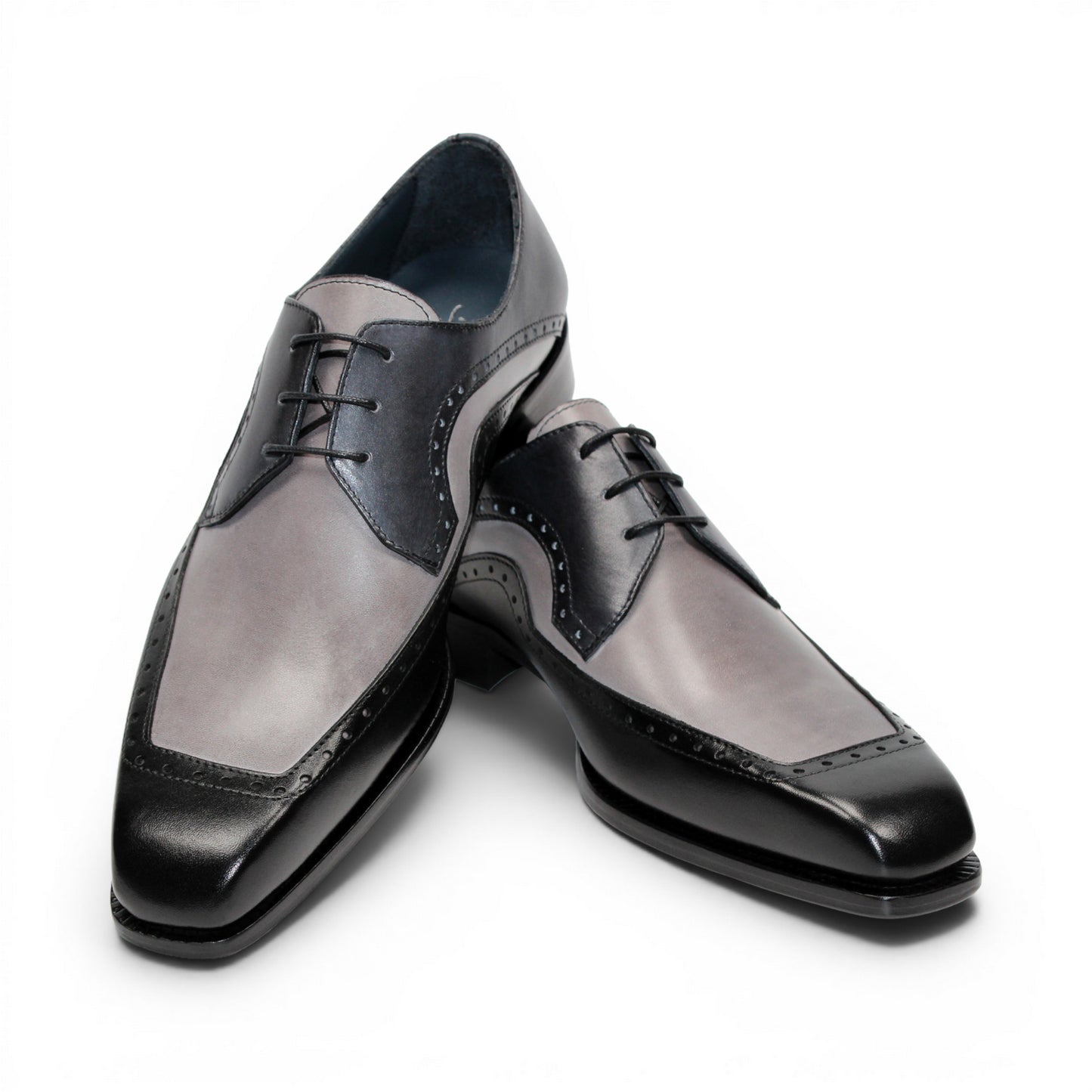 The Duca Di Matiste Duca Velletri Black Combo is a black and gray calf leather dress shoe with brogue detailing, lace-up closure, and low heel, shown side profile on white for timeless style.
