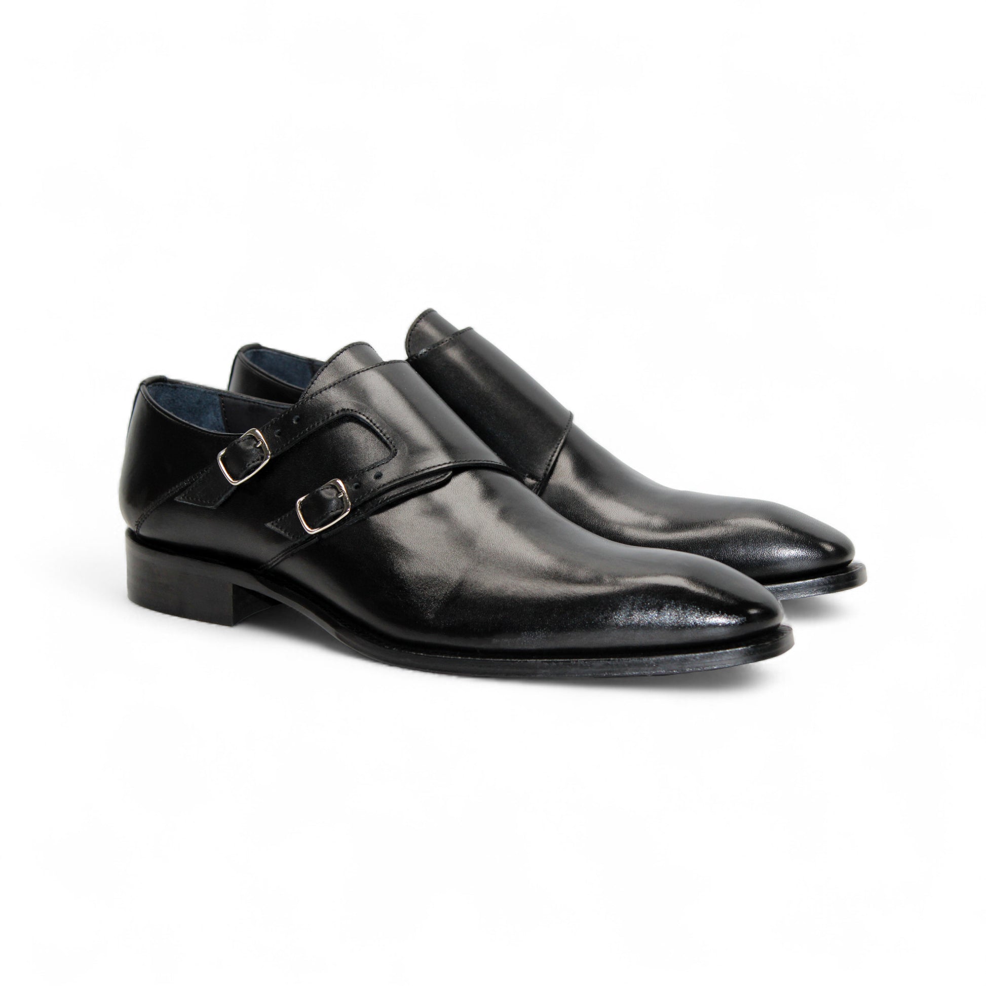 The Duca Vergato Black by Duca Di Matiste is an Italian leather double monk strap dress shoe with two buckles, a low heel, and almond toe, crafted from genuine leather and shown on a white background.