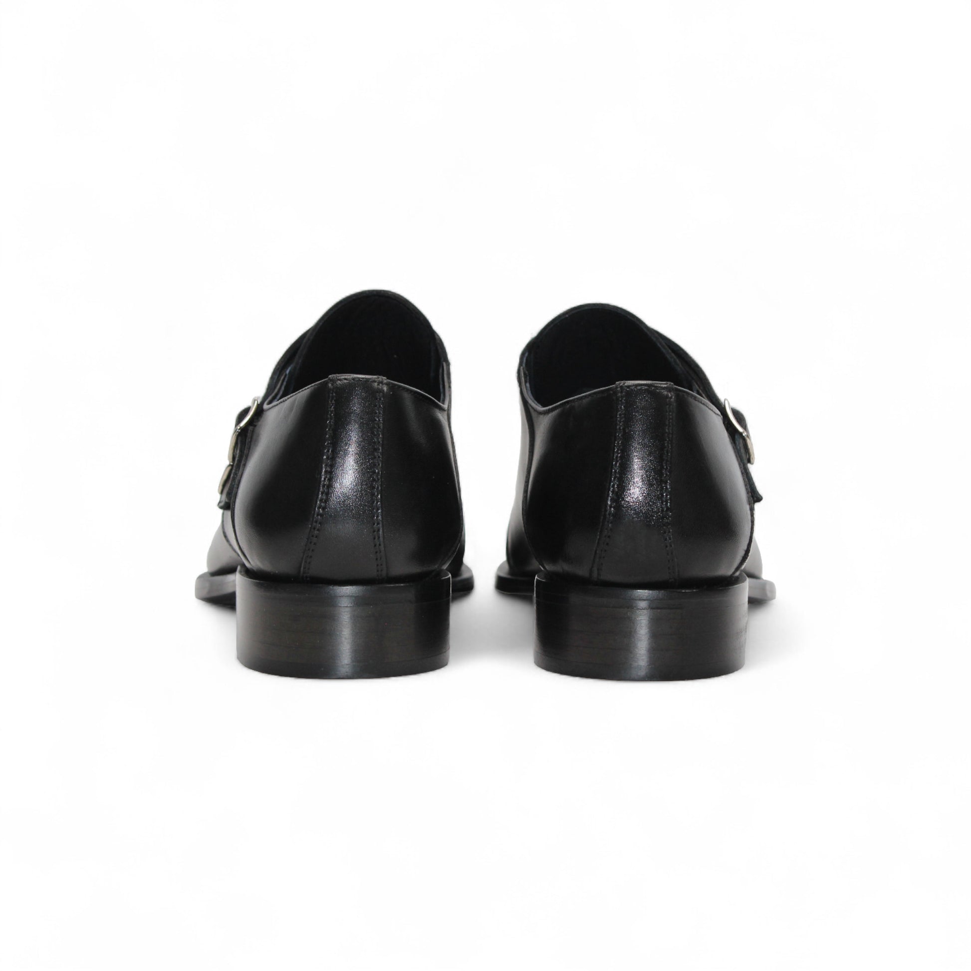 The Duca Vergato Black by Duca Di Matiste is an Italian leather double monk strap dress shoe with two buckles, a low heel, and almond toe, crafted from genuine leather and shown on a white background.