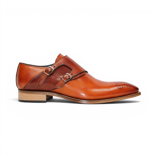The Duca Vergato Gold/Brown by Duca Di Matiste is an Italian leather monk strap dress shoe in brown, featuring two buckles and decorative perforations on the toe, displayed on a white background.
