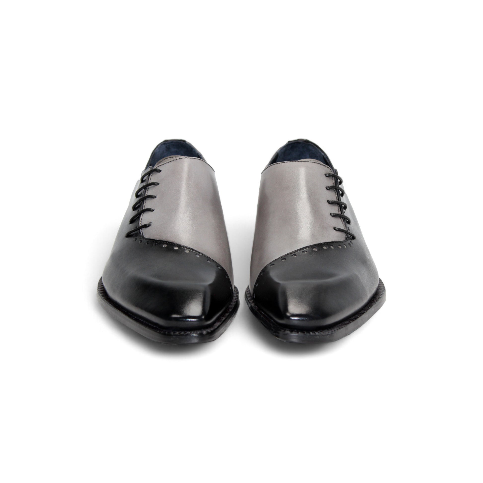 The Duca Di Matiste Duca Veroli Black/Grey is a black minimalist oxford crafted from genuine leather with closed lacing, a low heel, and a smooth finish—showcasing Italian craftsmanship against a white background.