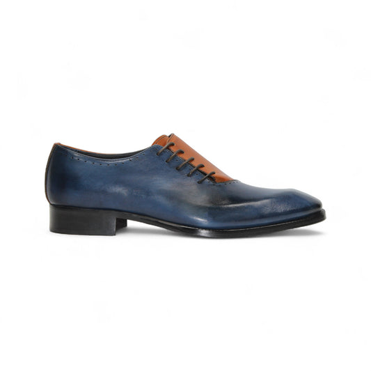 The Duca Di Matiste Duca Veroli Navy/Gold is a navy genuine leather oxford with black laces, a brown tongue, gold accents, and a low black heel, shown in a side view.