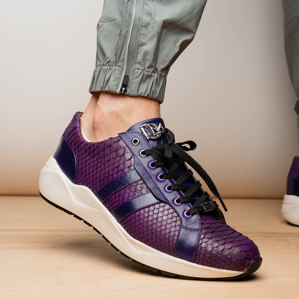 The Verona Purple by Marco Di Milano are hand-painted python sneakers with a textured scale pattern, black laces, and white soles—ideal for elevating any men's sneaker collection. One shoe stands while the other lies on its side.