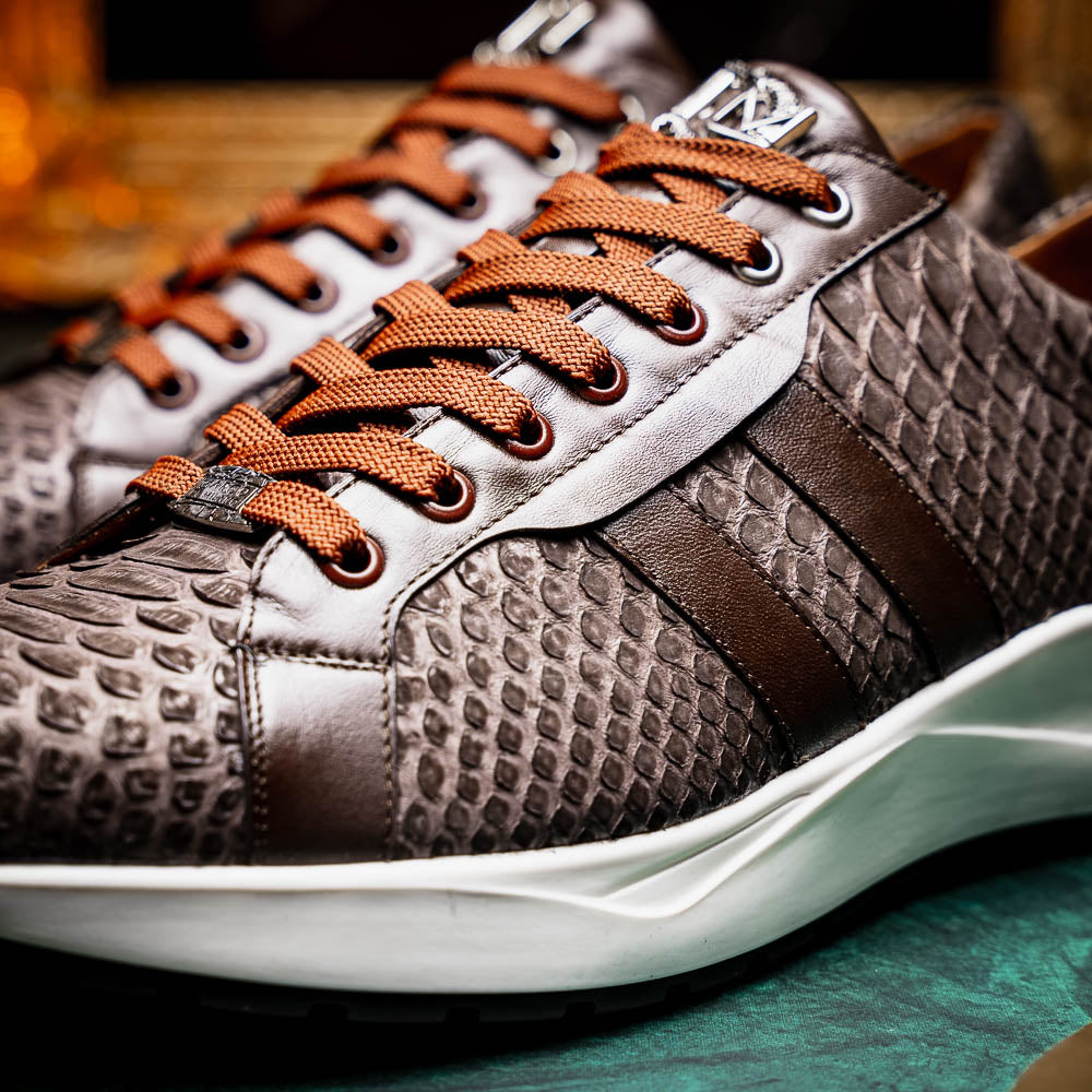The Verona Brown sneakers by Marco Di Milano are luxury men's shoes crafted in brown sueded python with a snakeskin pattern, white soles, brown laces, and a metal tongue accent—perfect for standout style.