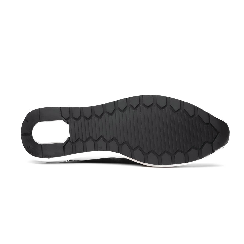 The Marco Di Milano Verona Green sneakers are luxury shoes with scale-like patterns, dark green accents, and white soles. One shoe is upright while the other lies on its side.