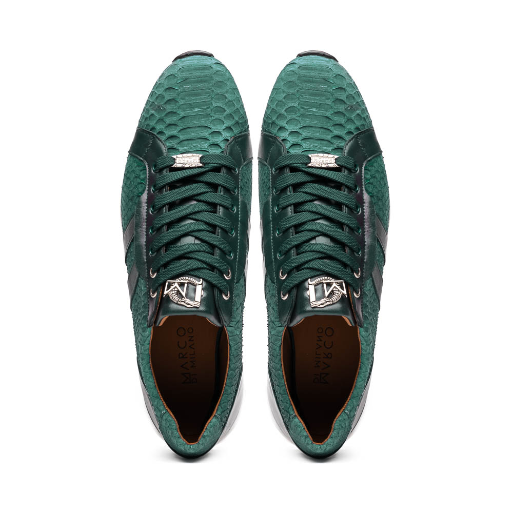 The Marco Di Milano Verona Green sneakers are luxury shoes with scale-like patterns, dark green accents, and white soles. One shoe is upright while the other lies on its side.