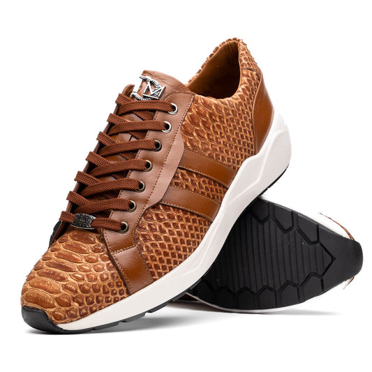 The Marco Di Milano Verona Honey is a brown luxury sneaker with a textured, reptile-like pattern, leather accents, brown laces, and a white sole. One men’s genuine calfskin shoe stands upright; the other displays its sole.
