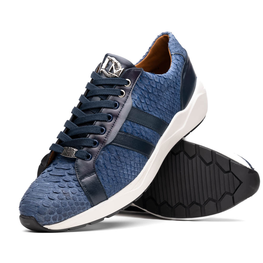 The Verona Navy sneakers by Marco Di Milano feature a blue python texture, navy laces, side stripes, and white rubber soles—luxury footwear with one shoe upright and the other on its side.