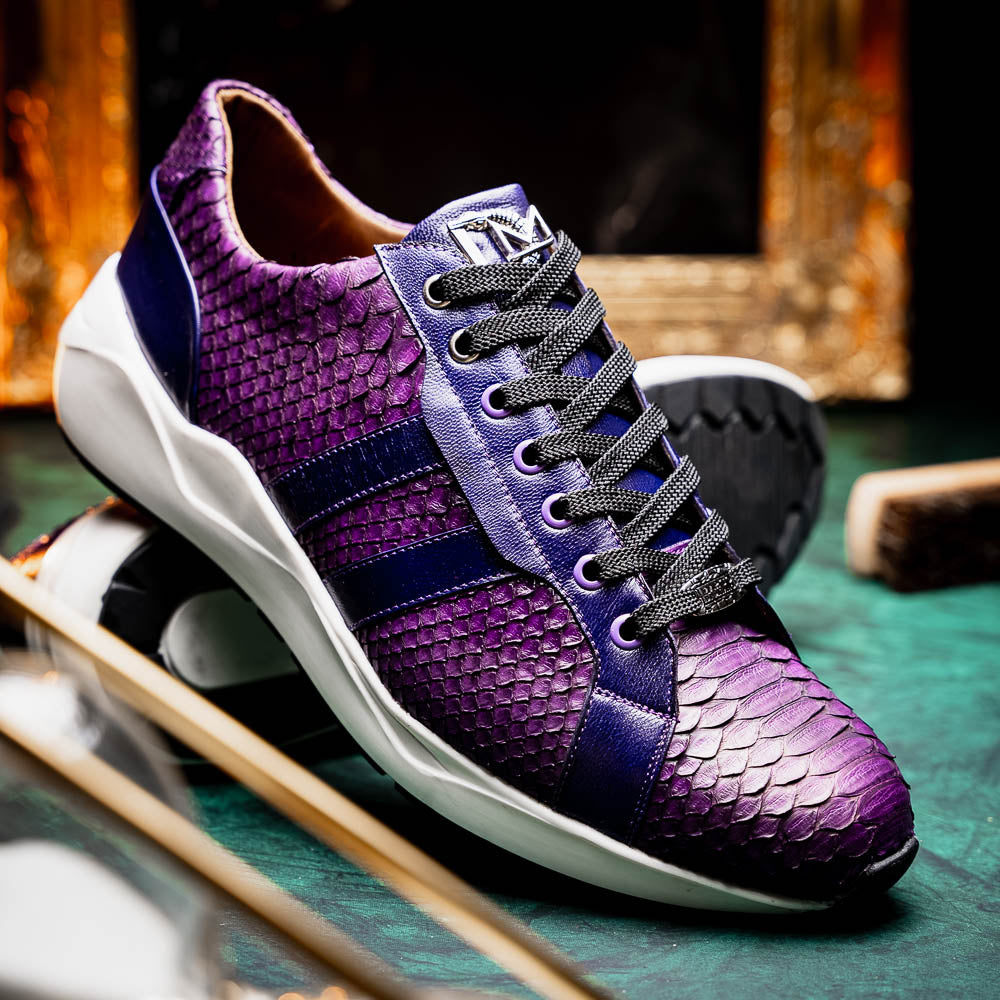 The Verona Purple by Marco Di Milano are hand-painted python sneakers with a textured scale pattern, black laces, and white soles—ideal for elevating any men's sneaker collection. One shoe stands while the other lies on its side.