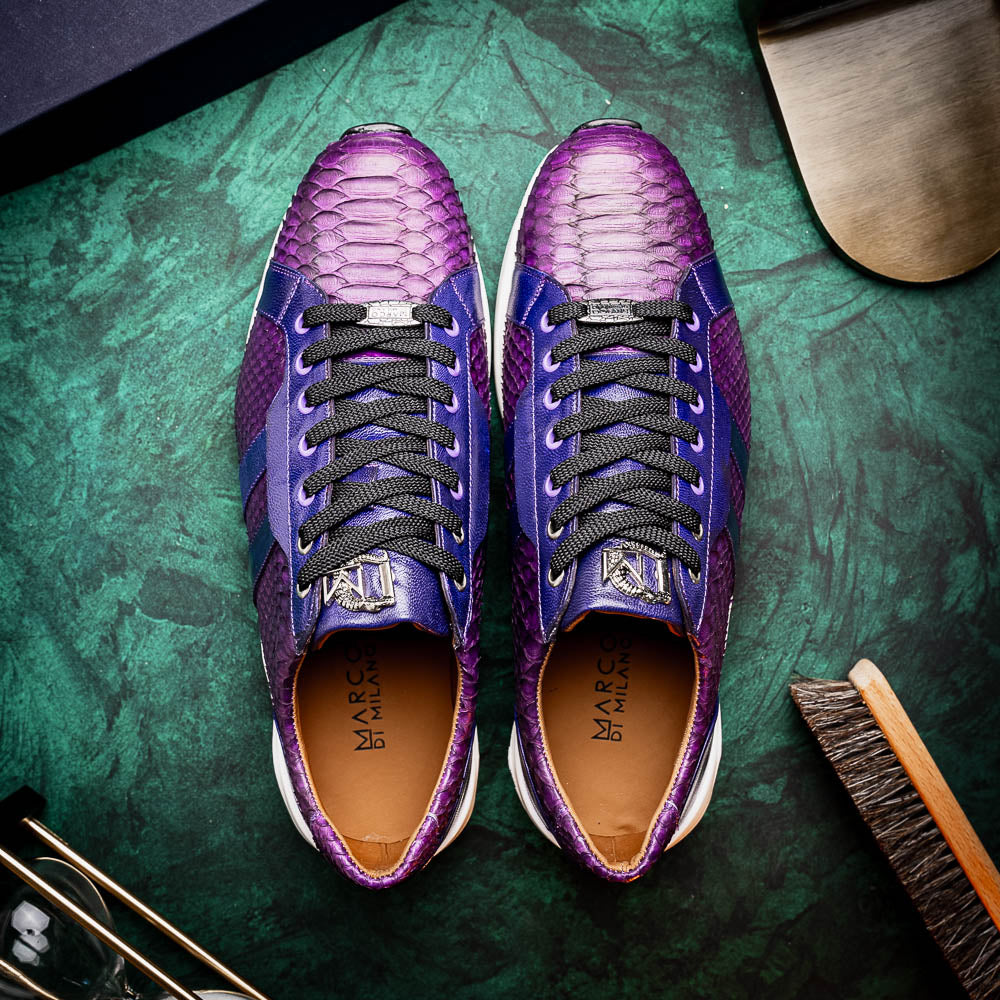 The Verona Purple by Marco Di Milano are hand-painted python sneakers with a textured scale pattern, black laces, and white soles—ideal for elevating any men's sneaker collection. One shoe stands while the other lies on its side.