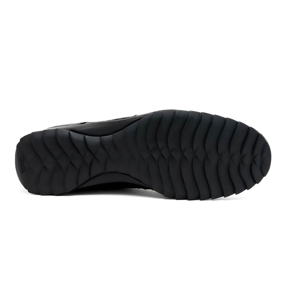 The Vulcan Black by Marco Di Milano are black, crocodile-patterned leather dress shoes with rubber soles—one upright and one displaying the sole. This luxury footwear features hand-painted finishes for a truly refined look.