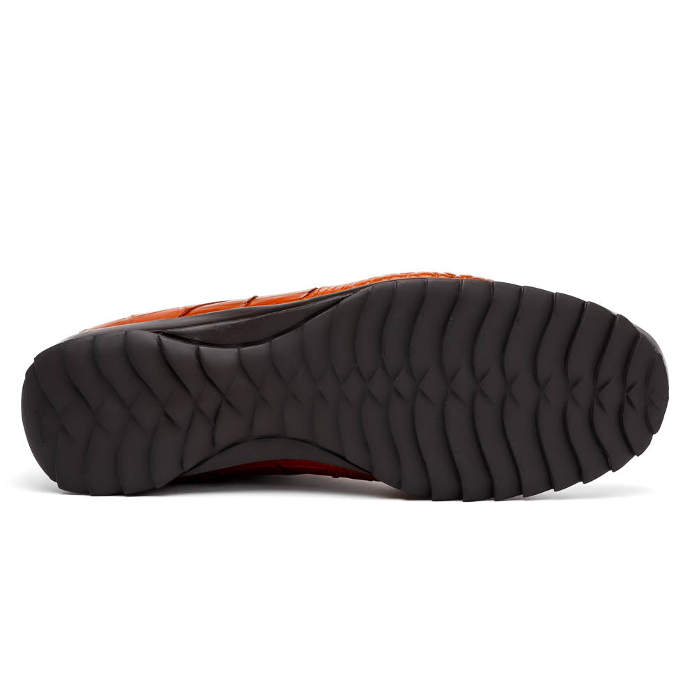 The Marco Di Milano Vulcan Honey features orange, crocodile-patterned leather dress shoes with hand-painted finishes and black rubber soles; one shoe stands upright while the other rests on its side below.