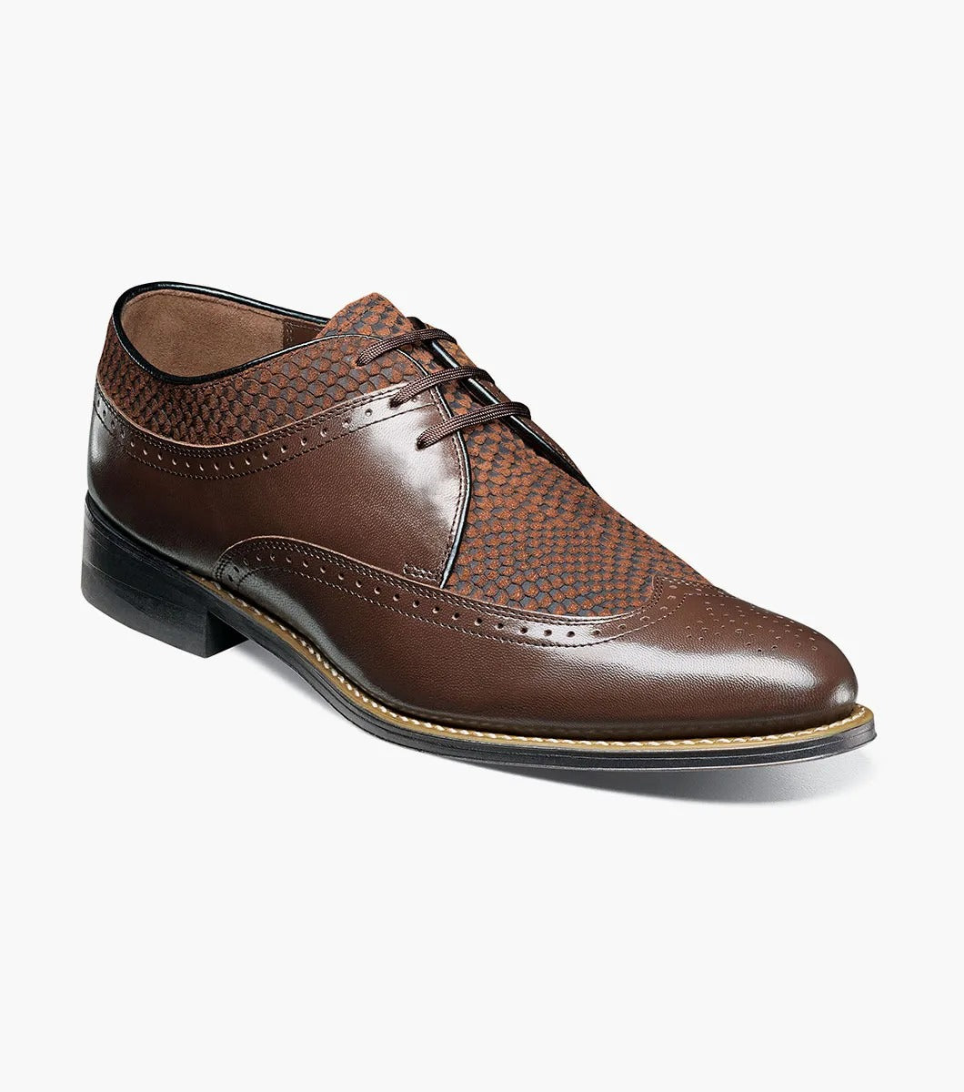 The STACY ADAMS Dayton Python Print Wingtip Oxford in brown features a textured upper, cushioned footbed, lace-up closure, and low heel—model 00626-200—shown against a plain white background.