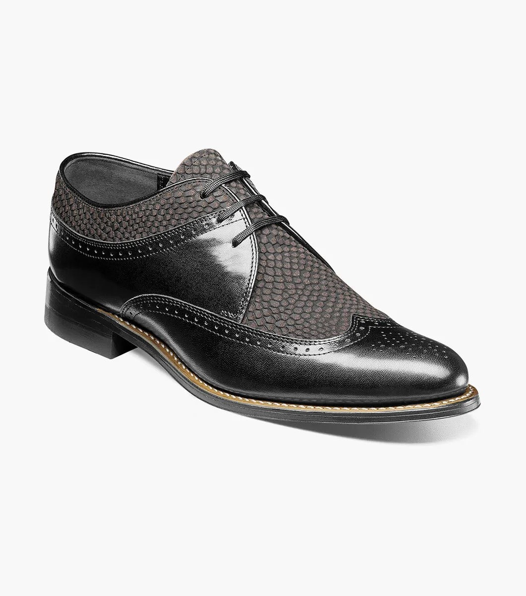 The Stacy Adams Dayton Python Print Wingtip Oxford in Black/Gray (00626-975) features kidskin leather with textured dark grey panels, lace-up closure, cushioned footbed, and a low heel. Shown on a white background.
