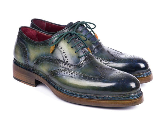 Elevate your style with the Paul Parkman Triple Leather Sole Wingtip Brogues in Green & Blue. Crafted from hand-painted green leather, these men's brogues feature intricate perforations and are accented with dark green laces. Complete with a wooden heel and built using Goodyear welted construction, they offer both durability and elegance for any occasion.