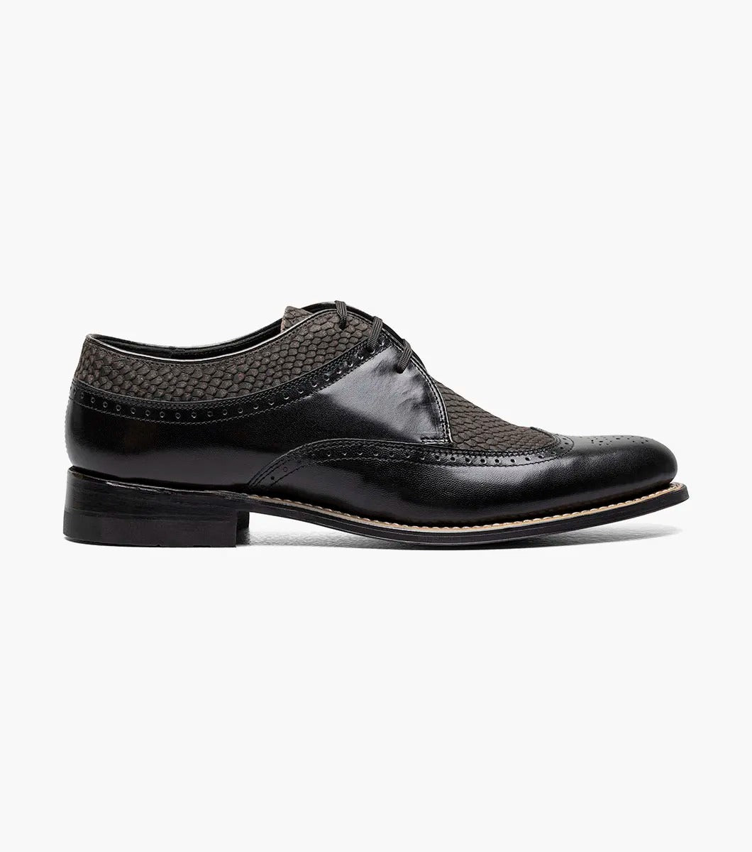 The Stacy Adams Dayton Python Print Wingtip Oxford in Black/Gray (00626-975) features kidskin leather with textured dark grey panels, lace-up closure, cushioned footbed, and a low heel. Shown on a white background.