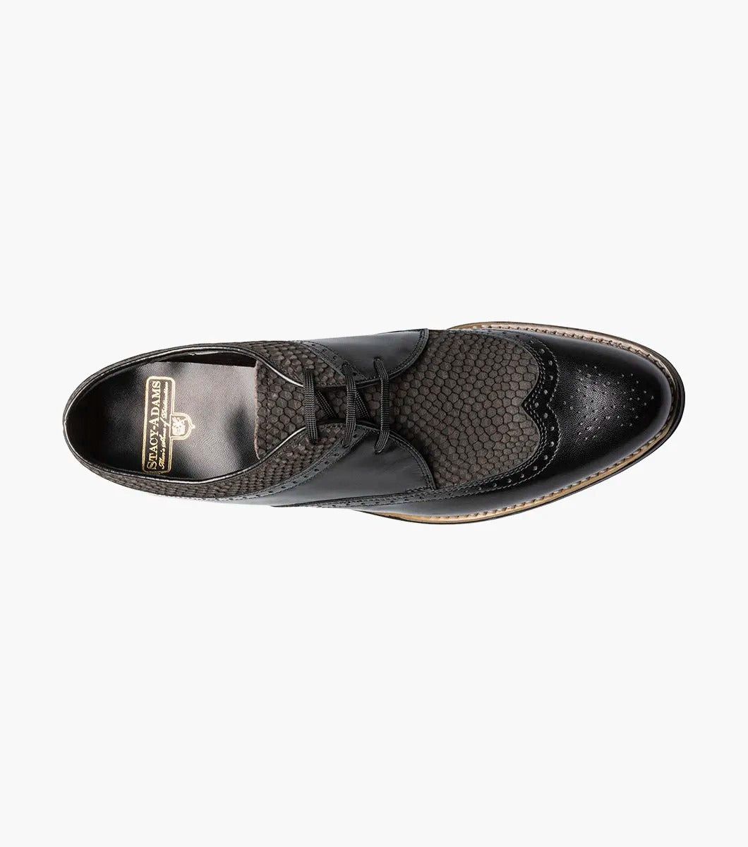 The Stacy Adams Dayton Python Print Wingtip Oxford in Black/Gray (00626-975) features kidskin leather with textured dark grey panels, lace-up closure, cushioned footbed, and a low heel. Shown on a white background.