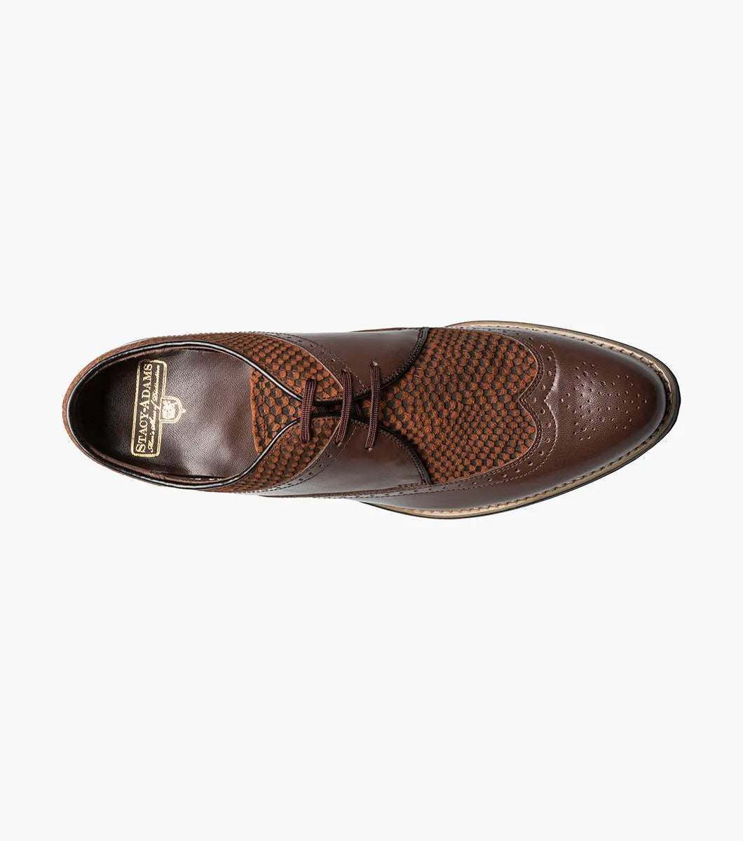The STACY ADAMS Dayton Python Print Wingtip Oxford in brown features a textured upper, cushioned footbed, lace-up closure, and low heel—model 00626-200—shown against a plain white background.
