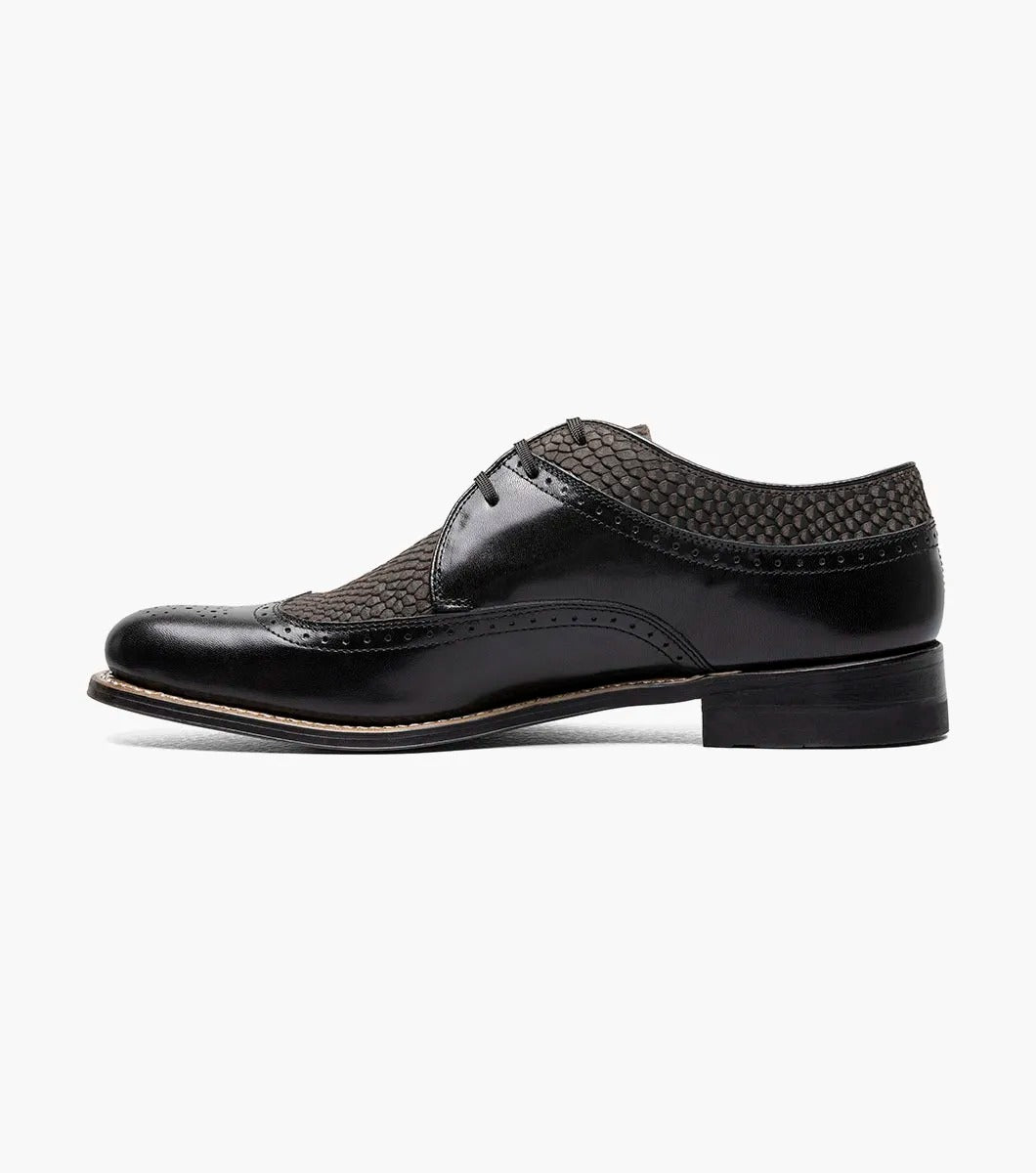 The Stacy Adams Dayton Python Print Wingtip Oxford in Black/Gray (00626-975) features kidskin leather with textured dark grey panels, lace-up closure, cushioned footbed, and a low heel. Shown on a white background.