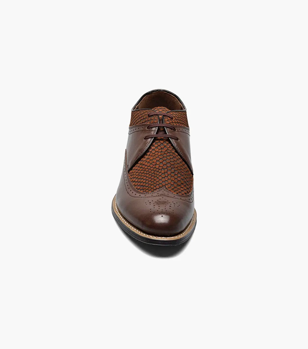 The STACY ADAMS Dayton Python Print Wingtip Oxford in brown features a textured upper, cushioned footbed, lace-up closure, and low heel—model 00626-200—shown against a plain white background.