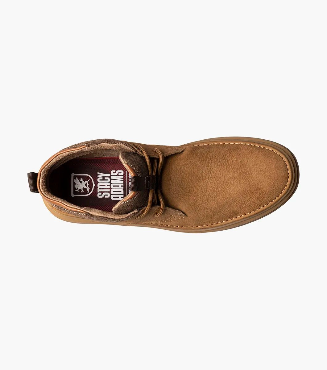 The Stacy Adams DELSON Plain Toe Chukka Boot in Camel (model 25556-228) has a durable rubber sole and lace-up front, offering anatomical arch support for all-day comfort against the crisp white background.