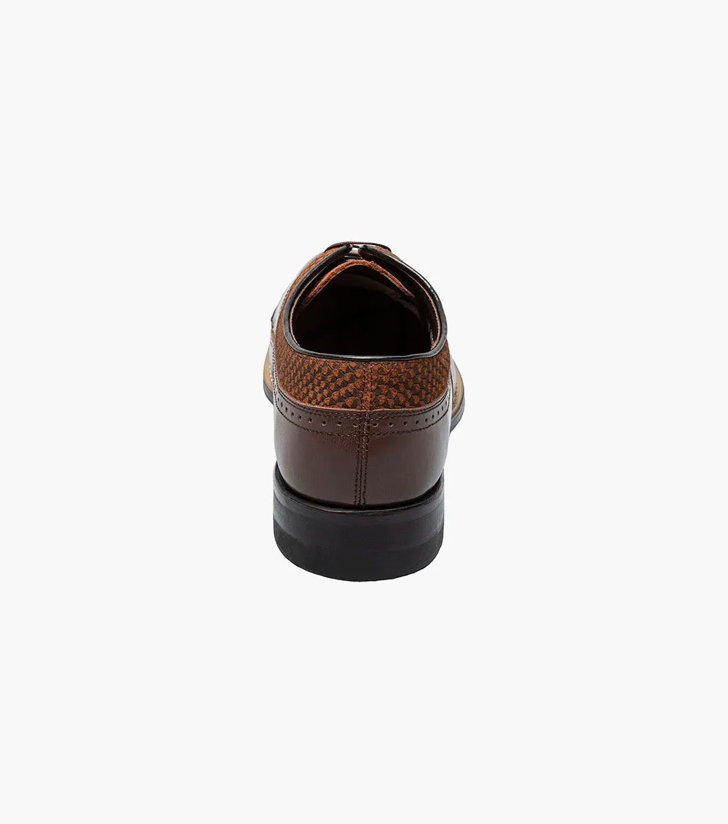 The STACY ADAMS Dayton Python Print Wingtip Oxford in brown features a textured upper, cushioned footbed, lace-up closure, and low heel—model 00626-200—shown against a plain white background.