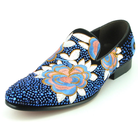 The FI-7360 Blue Stones slip-on shoe by Fiesso features blue suede with colorful sequins, rhinestones, and floral embroidery.