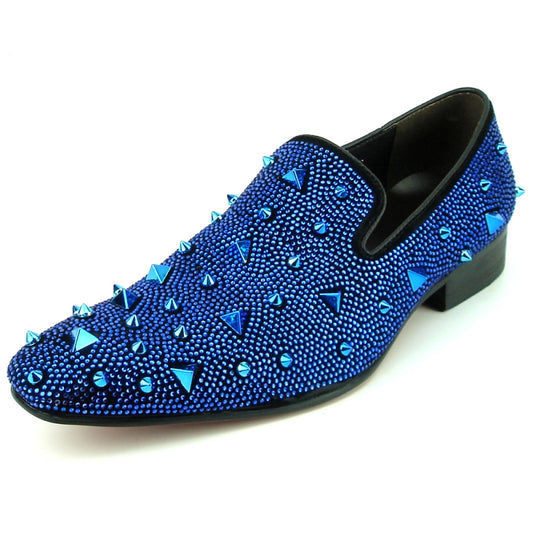 A blue suede slip-on shoe from Fiesso, the FI-7364-R Black/Blue Fiesso by Aurelio Garcia, embellished with shiny studs and pyramid-shaped spikes on the upper surface, offering a touch of fashion-forward elegance.