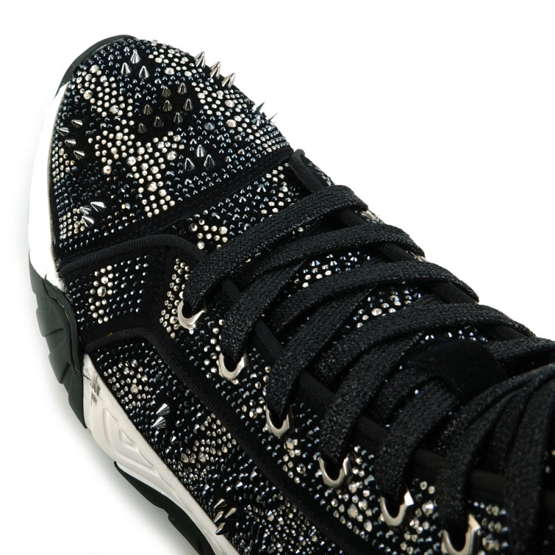 The FI-2412 Black Suede Rhinestones Spikes Encore by Fiesso is a high-top sneaker boot featuring a black suede upper with intricate studded embellishments. It boasts a thick white and black sole and comes with a cushioned insole for both style and comfort.