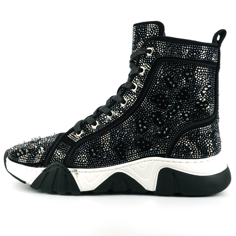 The FI-2412 Black Suede Rhinestones Spikes Encore by Fiesso is a high-top sneaker boot featuring a black suede upper with intricate studded embellishments. It boasts a thick white and black sole and comes with a cushioned insole for both style and comfort.