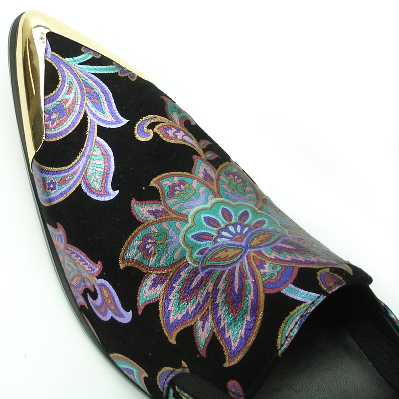 The FI-7133 Black Floral Metal Tip loafer by Fiesso features a metallic pointed toe and low heel, adorned with a vibrant pattern on a black background. This stylish shoe also includes a cushioned insole for enhanced comfort.