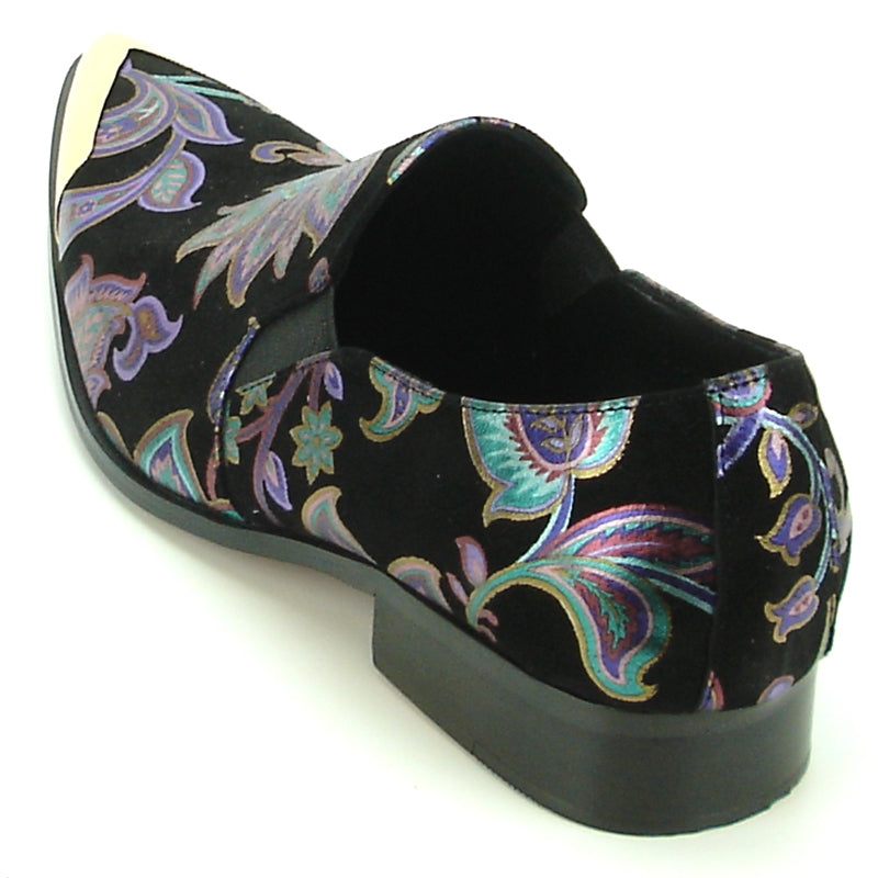 The FI-7133 Black Floral Metal Tip loafer by Fiesso features a metallic pointed toe and low heel, adorned with a vibrant pattern on a black background. This stylish shoe also includes a cushioned insole for enhanced comfort.