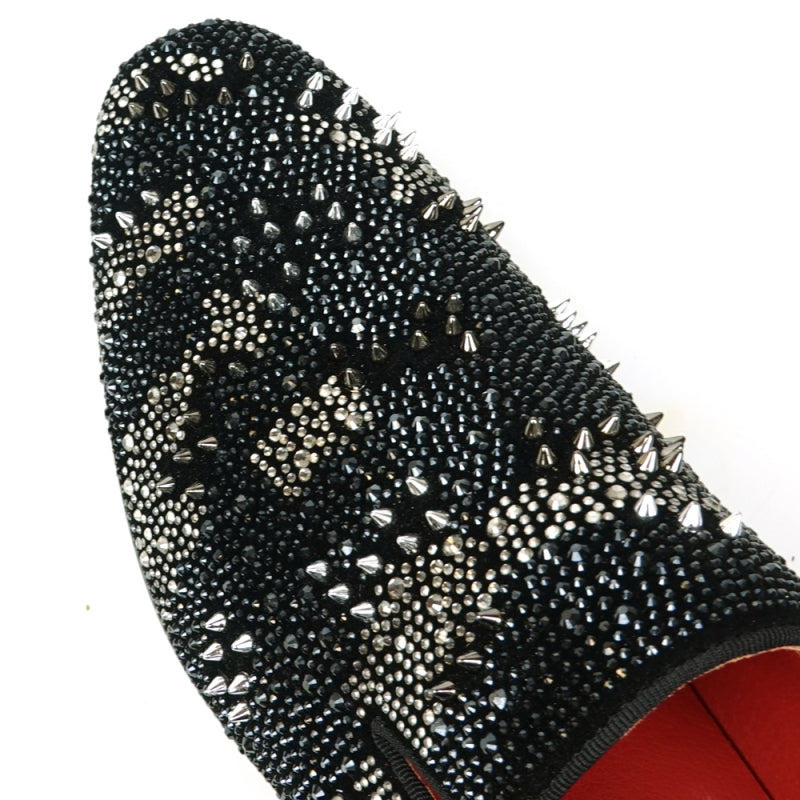 The FI-7516 Black Silver Suede Rhinestones Spikes Slip-On Loafer from Fiesso by Aurelio Garcia features a white polka dot pattern and small rhinestone spikes, complemented by a striking red interior lining. Ideal for those looking for high-fashion men's dress shoes with a unique twist.