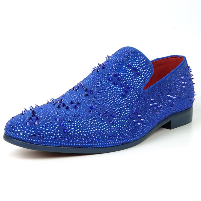 The FI-7516 Blue Suede Rhinestones Spikes Slip On Loafer from Fiesso by Aurelio Garcia effortlessly blends elegance with an edgy touch. Featuring blue rhinestone spikes and a bold red interior lining, this standout shoe is an ideal addition to any men's dress wardrobe, offering a unique flair that perfectly complements your style.