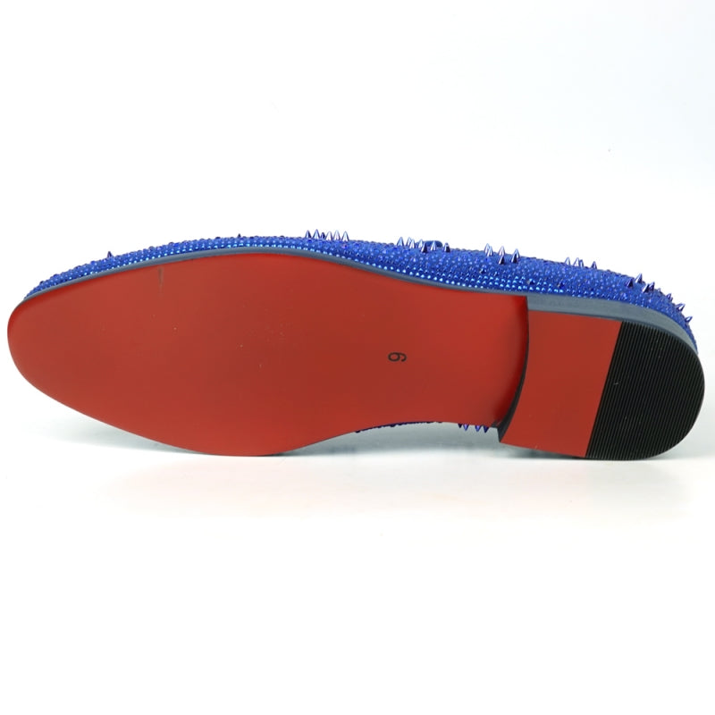 The FI-7516 Blue Suede Rhinestones Spikes Slip On Loafer from Fiesso by Aurelio Garcia effortlessly blends elegance with an edgy touch. Featuring blue rhinestone spikes and a bold red interior lining, this standout shoe is an ideal addition to any men's dress wardrobe, offering a unique flair that perfectly complements your style.