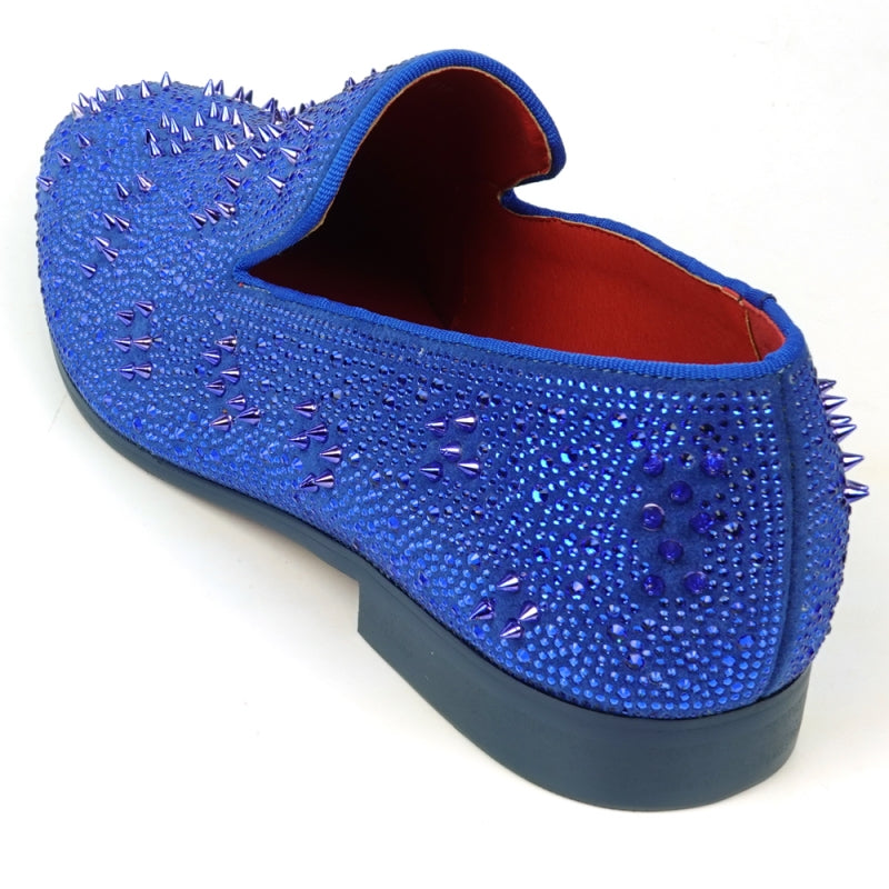 The FI-7516 Blue Suede Rhinestones Spikes Slip On Loafer from Fiesso by Aurelio Garcia effortlessly blends elegance with an edgy touch. Featuring blue rhinestone spikes and a bold red interior lining, this standout shoe is an ideal addition to any men's dress wardrobe, offering a unique flair that perfectly complements your style.