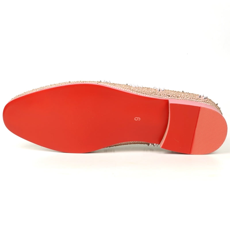 The FI-7516 Pink Suede Rhinestones Spikes Slip on Loafer by Fiesso is a remarkable design, embellished with dazzling rhinestones and spikes. It has a low heel and a sumptuous red interior, ideal for those who enjoy making bold fashion statements.