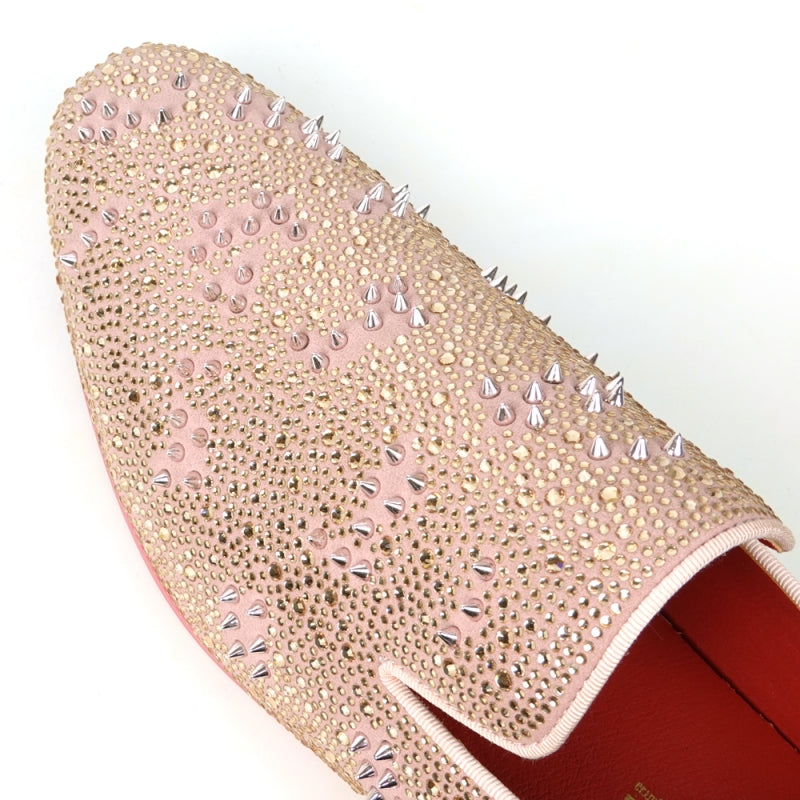 The FI-7516 Pink Suede Rhinestones Spikes Slip on Loafer Fiesso by Aurelio Garcia is a single pink suede loafer embellished with sparkling rhinestones and small spikes, and it features a red interior and sole.