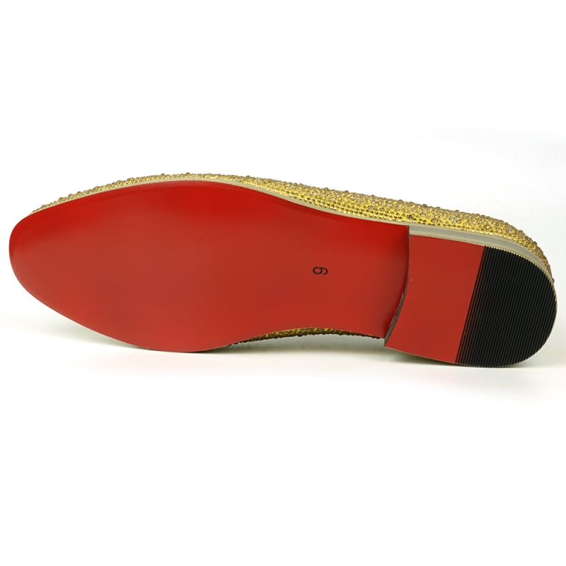 The FI-7525 Gold Suede Slip-on Loafer by Fiesso is a dazzling masterpiece, adorned with gold rhinestones and featuring a bold red interior lining.