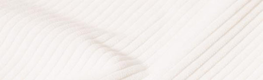 Close-up of Inserch Cotton Flat Front Corduroy Pants P3103-155 in Winter White, showcasing a ribbed fabric with diagonal lines that create a textured pattern, which is reminiscent of the sleek, modern fit seen in corduroy designs.