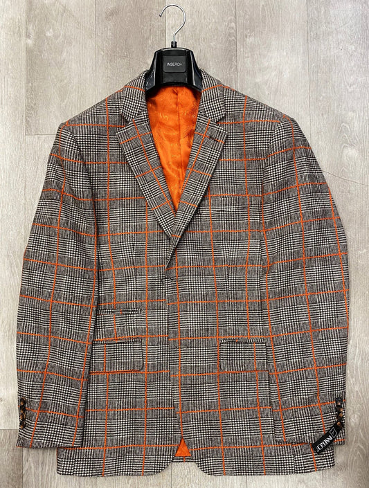 The Inserch Wool Blend Glenn Check Blazer BL002-25 Brown (FINAL SALE, SIZE S ONLY) features an orange lining and orange windowpane pattern, shown on a hanger against a wooden background.