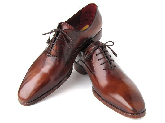 A pair of Paul Parkman Plain Toe Brown Calfskin Oxfords for men, elegantly laced and carefully positioned to highlight the sides and front.