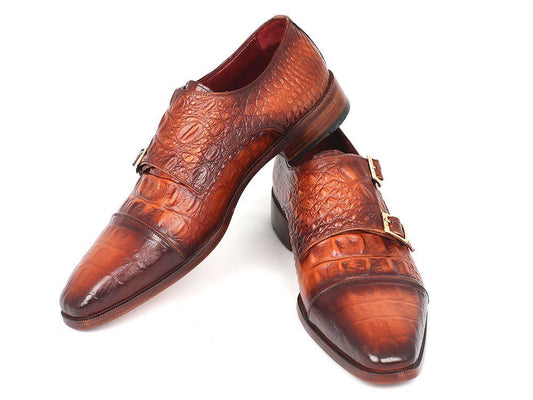 The Paul Parkman Double Monkstrap in brown crocodile embossed calfskin, model PP2280, elegantly showcases its handmade design with double monk straps against a white background.