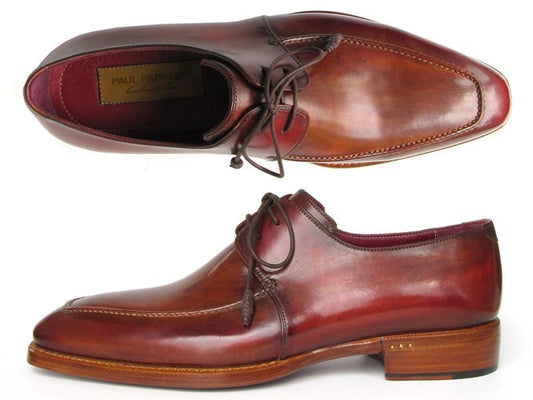 Presenting the Paul Parkman Goodyear Welted Square Toe Apron Derby Shoes in Brown (Model 322A7), crafted from brown leather and featuring a polished finish with wooden soles. These handmade shoes, designed for durability and style, boast a lace-up design and are showcased in top and side perspectives.