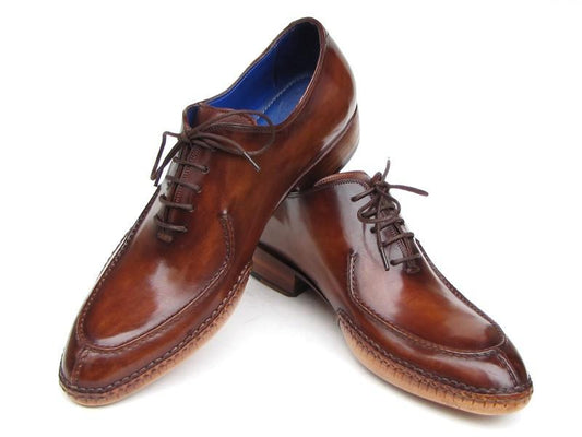 Paul Parkman Side Handsewn Split-toe Brown Oxfords (model 054-BRW) displayed on a white background, featuring polished brown leather with stitching details, made-to-order for men.
